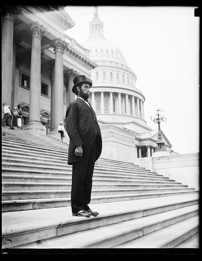 Person dressed as Abraham Lincoln on steps of U.S. Capitol, Washington, D.C.