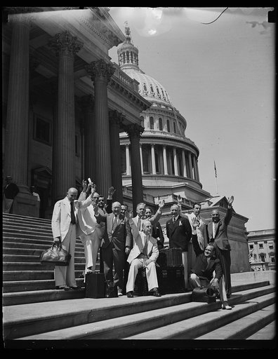 Wash. D.C. Beating the Gun. These congressmen gather on the steps of the Capitol in an effort to beat the adjournment gun by a few minutes. The session was drawing to a close as this photo was made. From the left: Representatives Herman P. Koppleman, D. of Conn.: John J. Delaney, D. of NY: William P