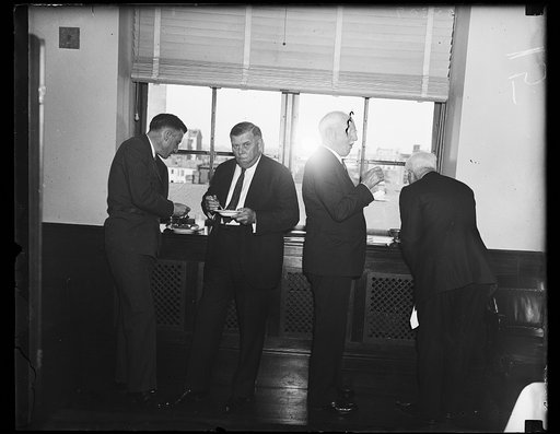 Wash. D.C. C of C refreshments. Eric A. Johnston, Spokane, left: and T. Guy Woolford, Atlanta, Ga., and Vice President of the U.S. Chamber of Commerce, photographed at the meeting here where the Chamber formulated a definite policy concerning New Deal legislation. 9/20/35