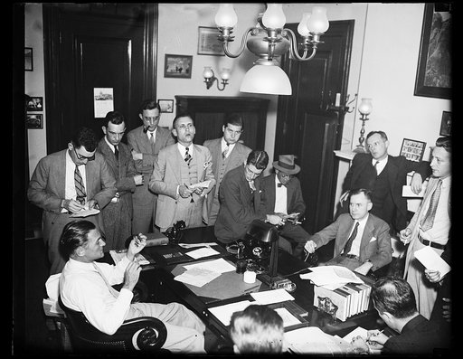 A special meeting. Sen. Gerald P. Nye, and Sen. Homer T. Bone (left to right seated) members of the Senate Munitions Committee, called a special meeting today to discuss the possibility of a Senate investigation of Ethiopian oil concessions. They are shown here as they talked to the members of the p