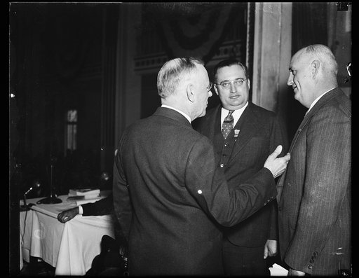 L to r: Wm. Green, [Pres.?], Harvey C. Flemming, Wash. D.C., Ch. of Reception Comm., Ray Murphy, Nat. Com. Amer. Legion