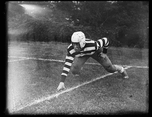 Pres. Wilson's grandson takes up football. Woodrow Sayre, son of Francis (State Dpt.) Sayre, and grandson of the late President, Woodrow Wilson, photographed in his football outfit at St. Albans School, Washington. Young Sayre recently clinched his job as regular right end of the team. 10/12/35
