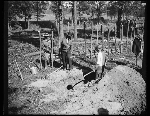 Pilot. "A" boss is shown here instructing a transient worker in ditch digging at "Tugwelltown," the government-owned project started in Maryland near the District of Columbia. 10/15/35