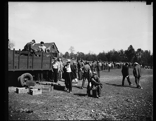 Lunch time at Tugwelltown. This line up shows a portion of the approximate 500 transients working on the Rehabilitation project popularly known as "Tugwelltown," as they get their lunch. 10/15/35