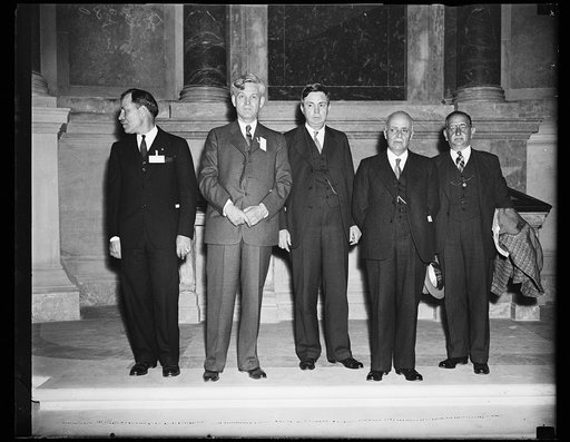 Archive group meets Mexican delegation representatives. Officials of the Archives building in Washington meet with representatives of a Mexican delegation visiting Washington, D.C. From the left: John G. Bradley, Chief of the Division of Motion Pictures, U.S. Archives building; Dr. Roscoe Hill, Chie