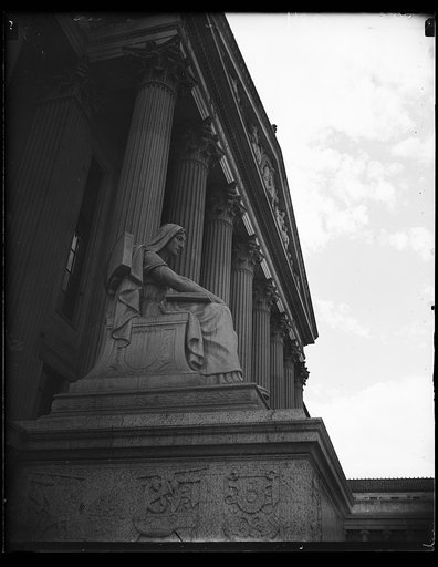 Nearing completion. This photograph shows the heroic statue at one entrance of the new Archives building, Washington, D.C. The building is nearing completion. 10/19/35