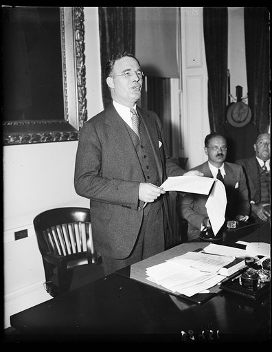 Speaks on housing. Russell G. Creviston, Chairman of the Manufactures' Housing Display Council, addressing a meeting of that body in the Treasury Department. 10/30/35