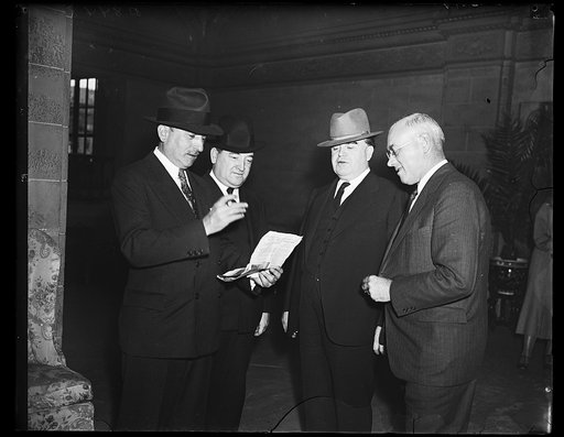 Still in disagreement. This executive photograph taken at the coal strike conference in Washington found the principles as far apart as the poles. From the left: Edward F. McGrady, Assistant Secretary of Labor; James F. Dewey, Labor Department conciliator; John L. Lewis, President of United Mine Wor