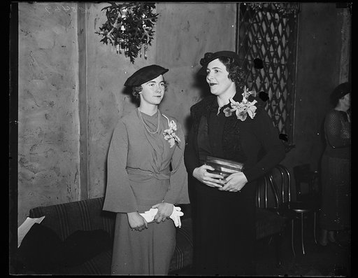 Junior League luncheon. Miss Anne Carter Green, left, president of the Junior League of Washington, and Mrs. Robert F. Dingman, New York City, representing the Association of Junior Leagues of America, photographed at the League luncheon which launches the new program of welfare work for the coming 
