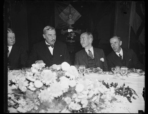 At Navy luncheon. Secretary Claude Swanson, center, gives a stag luncheon in honor of Vice Admiral Sir Matthew R. Best, Royal Navy. From the Left: Sir Ronald Lindsay, Ambassador from England; Secretary Swanson, and Vice Admiral Best, the Vice Admiral is commander-in-chief of the British Navy in the 