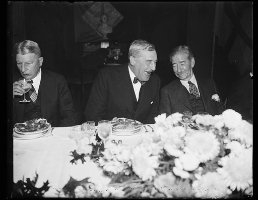 Good for the disposition. The remark which caused the hearty laughter of Sir Ronald Lindsay, left, Ambassador from England, and Secretary of Navy Claude Swanson may have been almost anything. It was a stag affair, a luncheon given by the Secretary for Vice Admiral Matthew R. Best of the Royal Navy. 