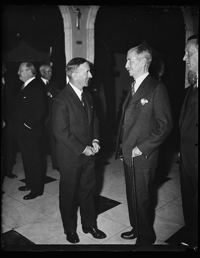 Vice Admiral Sir Matthew R. Best, Commander-in-Chief of the American and West Indian stations of the Royal Navy, left, meets Secretary Claude Swanson. Admiral Best is visiting in Washington for a few days. 11/2/35