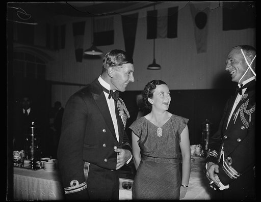 The Admiral's daughter. Lt. J.R.B. Longden meets Miss Margaret Best, daughter of Vice Admiral Sir Matthew R. Best and Lady Best at the Navy Yard rail loft dance given for the visiting Britishers by the commandant and officers of the Navy Yard. 11/2/35