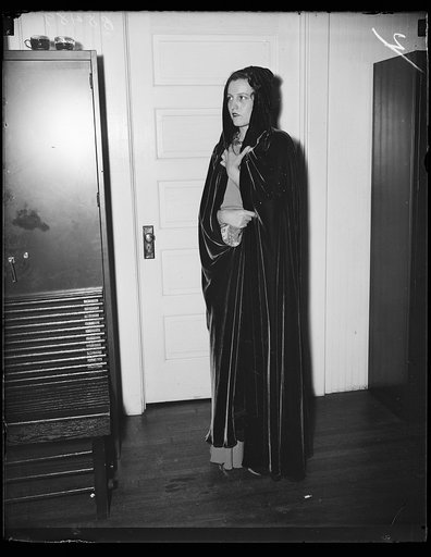 Mrs. Reginald Mead, wife of Lt. Mead, U.S.N. [...td], wore this red velvet evening wrap at the dance given in the Navy Yard sail loft by the commandant and officers of the Navy Yard for Vice Admiral Sir Matthew R. Best of the Royal Navy. This wrap is the newest in smart evening attire. 11/2/35