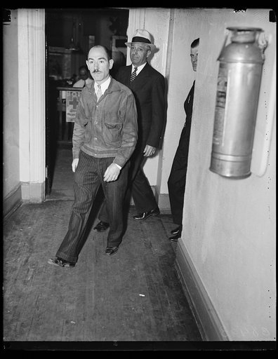 Held in kidnapping. District of Columbia police arrested Jerry Riley, left, in connection with the 1928 kidnapping of Charles Mattler in Detroit, Mich. Riley, according to the police, also is known as Andrew J. Mack, Jerry Riley, Dennis Regan and John Kellly. He was arrested at the request of Detroi