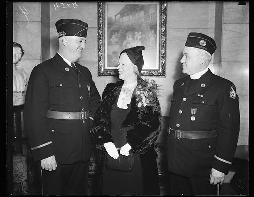 Leaders of the Legion. These leaders of the American Legion and its auxiliary photographed in Washington where they took leading parts in the Armistice Day ceremonies. From the left: Ray Murphy, National Commander; Mrs. Melville Mucklestone, National Pressident of the Auxiliary, and the Rev. Father 