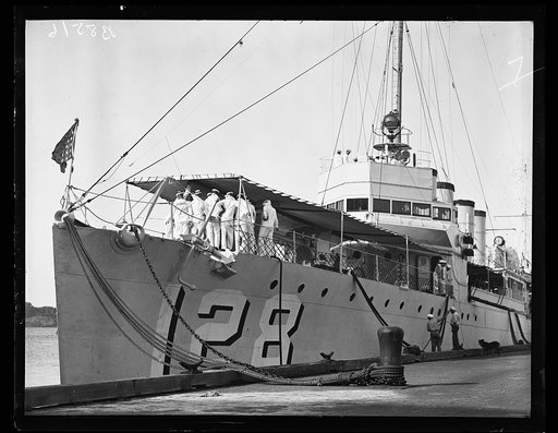 The source of the "bang." Members of the first "big" plebe class at U.S. Naval Academy at Annapolis, Md., shown aboard the U.S.S. Babbitt, destroyer, where the newcomers are examining a deck gun. The boys are having quite a time before the regular opening of the academy for all classes. 9/20/35
