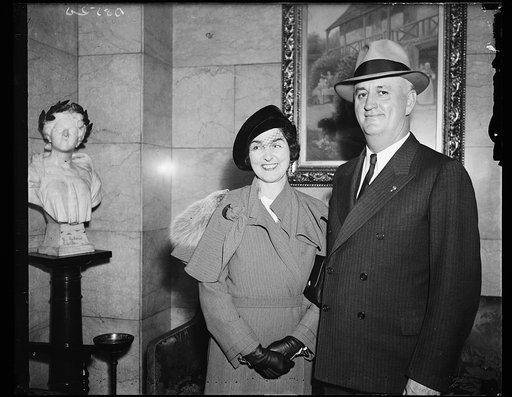 Legion Commander and Mrs. Murphy. Commander Ray Murphy of the American Legion and Mrs. Murphy photographed as they prepared to leave Washington, D.C, following the Armistice Day exercises at the Tomb of the Unknown Soldier in Arlington cemetery. 11/12/35