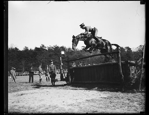 Wash. D.C. U.S. Entry. Captain E.F. Thompson takes Masquerader over a jump as a U.S. representative at the Inter-American horse show. 10/26/35