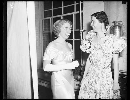Younger set at Navy loft. Wash. D.C. Helen Defrees, left, daughter of Rear Admiral and Mrs. Joseph R. Defrees, commandment of the Navy Yard, and Lucil van Deer Friedell, daughter of Capt. W.L. Friedell, photographed at the Navy Loft party given by the command and officers for Vice Admiral ? Matthew 