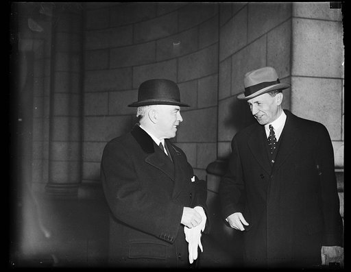 Trade pacters. Wash. D.C. Prime Minister William MacKenzie King, of Canada, left, and U.S. Minister Norman Armous, arrive in Washington to take part in the signing of the Canadian-U.S. trade pact. Armour and MacKenzie King have been working on this pact since the Canadian elections. Details were con