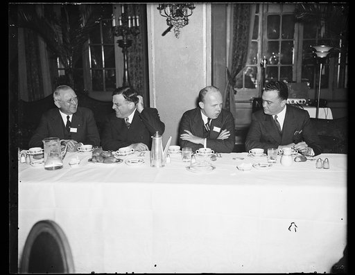 Wash. D.C. Distinguished company. The luncheon of the U.S. Conference of Mayors here today grouped, from the left: Mayor Howard W. Jackson of Baltimore; Mayor F.H. LaGuardia of New York; Henry Folbey, corporation counsel of Boston, and J. Edgar Hoover, chief of the Bureau of Investigation, Departmen