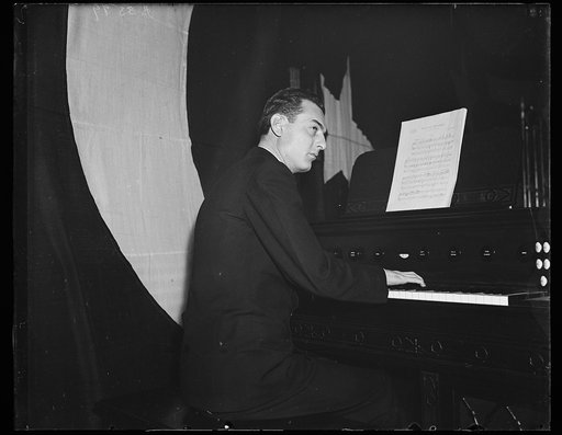 Wash. D.C. Navy band's new organ. William Arbuckle, musician first class of the U.S. Navy, at the new pipe organ which has been purchased to be included in the new 95-piece symphony orchestra which gives its first concert Tuesday night (11/26/35) at the Navy Yard Sail Loft. 11/25/35