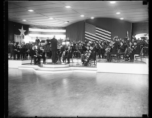 Navy band develops first symphony orchestra. This photograph shows a portion of the U.S. Navy Band's 95-piece symphony orchestra for the first time. This orchestra, under the leadership of Lt. Charles Bentor, will give its first concert at the Navy Yard Sail Loft Tuesday night (11/26/35). The Navy B