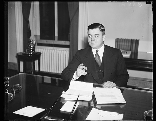 Budget building. Acting Director of the Budget, Daniel W. Bell, is busy since his Warm Springs conference with President Roosevelt on budget matters. He was photographed Friday (11/29/35) as he studied various and assorted figures. In addition to his position with the Budget Bureau, where he refused