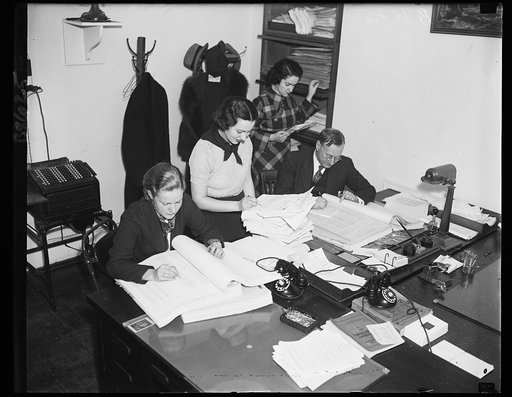 Spotting the dough. These employees of the Bureau of the Budget are preparing letters of allocation for the president's signature. They might be called the checker movers of the administration. 11/29/35
