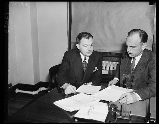 New legal light of SEC. Robert H. Jackson, now Special Counsel for Securities and Exchange Commission, left, photographed with James M. Landis, chairman of the SEC. Jackson formerly was Assistant General Counsel for the Treasury Department. 11/27/35