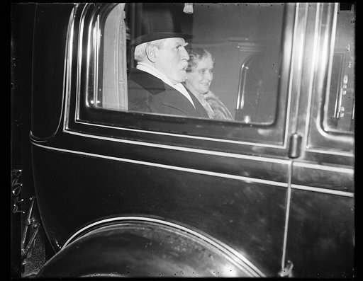 Charles Evans Hughes and wife in automobile