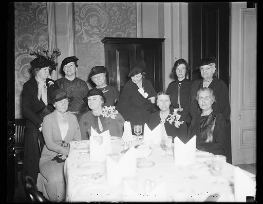 Group of women at table; Hattie Caraway? 2nd from right in front row