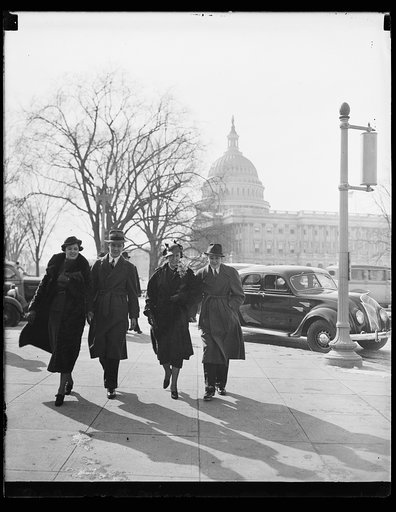 Men and women; U.S. Capitol in background. Washington, D.C.