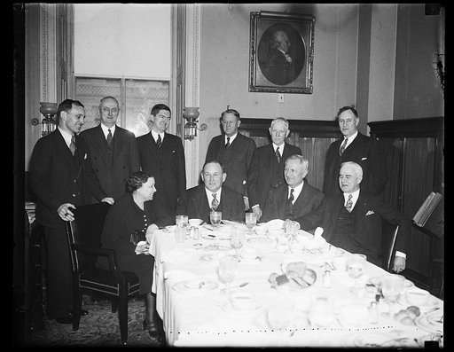 Group; Hattie Caraway, seated left; Joseph Robinson at head of table