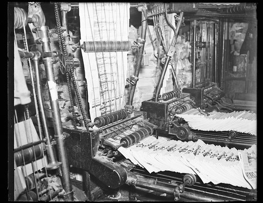 Newspapers coming off press