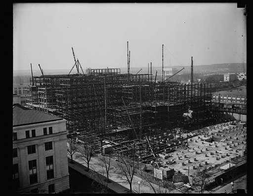 Interior Department Building under construction, 1849 C St. NW.; Lincoln Memorial in the distance, Washington, D.C.