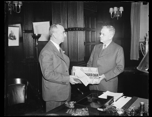 Harold Ickes, right; with case of Dole pineapple juice
