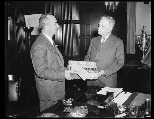Harold Ickes, right; with case of Dole pineapple juice
