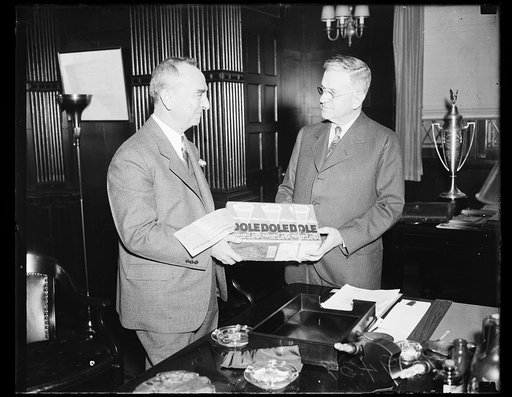 Harold Ickes, right; with case of Dole pineapple juice