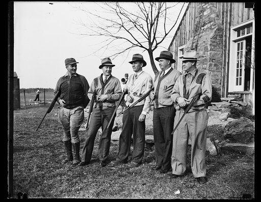 Group of men with guns dressed for hunting?