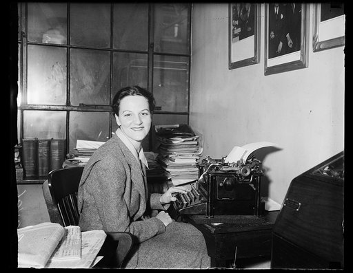 Woman at typewriter in office