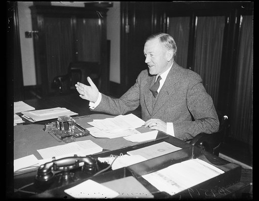 Charles L. McNary at desk