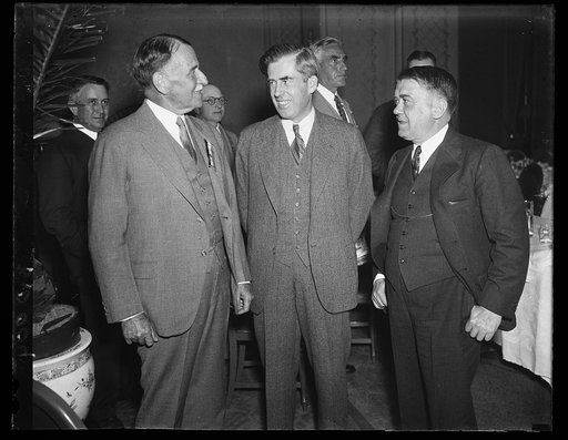 Henry A. Wallace, center