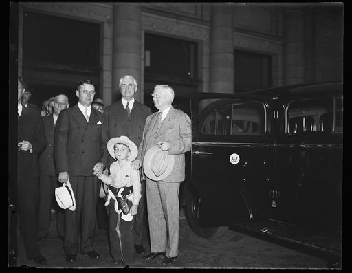 Jesse H. Jones, center, John Nance Garner, right