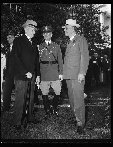 John J. Pershing, left; George Dern, right