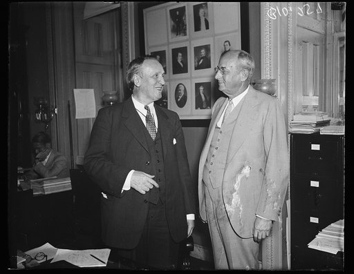 Homer S. Cummings, right