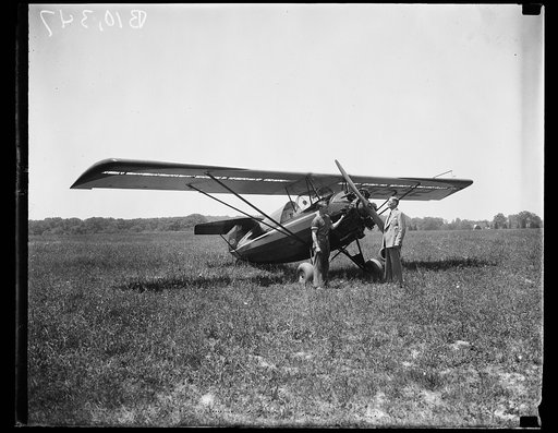 Unidentified men and airplane