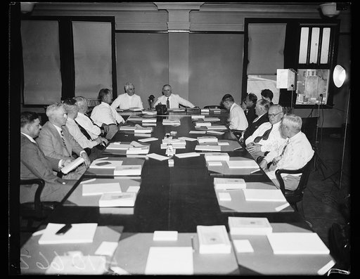 Group at table; William Green at head of table