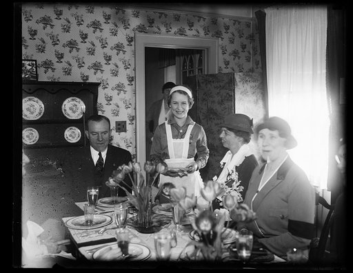 MRS. ROOSEVELT IS GUEST OF GIRL SCOUTS AT 15-CENT LUNCHEON. MRS. FRANKLIN D. ROOSEVELT ENJOYED A 15-CENT LUNCHEON TODAY AS GUEST OF THE GIRL SCOUTS IN THEIR 'LITTLE HOUSE' IN WASHINGTON. ON THE LEFT IS WALTER W. HEAD, PRESIDENT OF THE BOY SCOUTS OF AMERICA. FLORENCE YEAGER IS THE GIRL SCOUT SERVING 